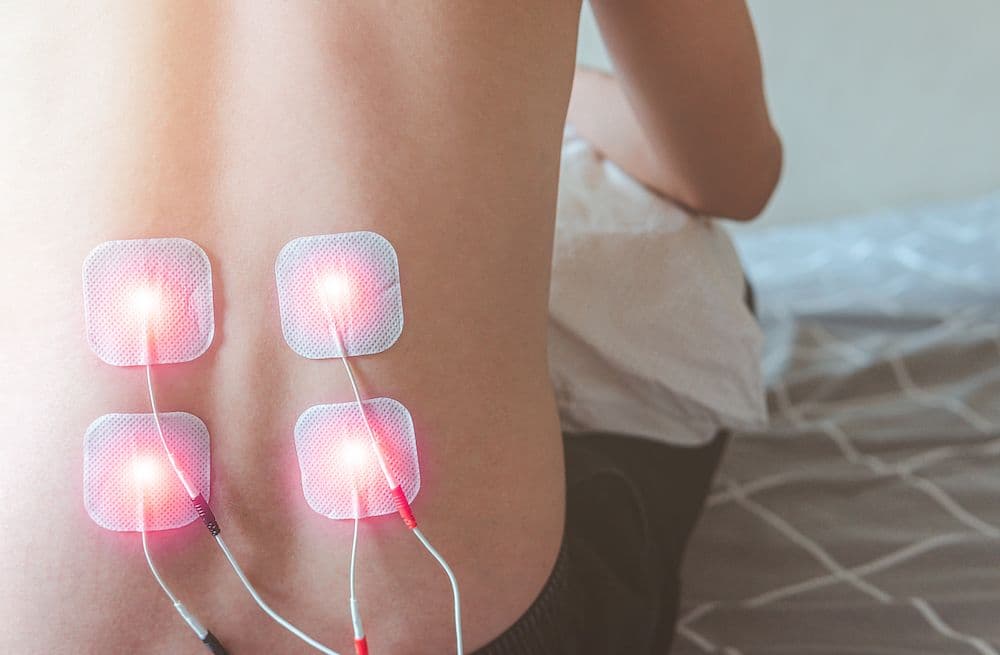 E-stim electrical muscle stimulation therapy at CornerStone Chiropractic in Minot, North Dakota