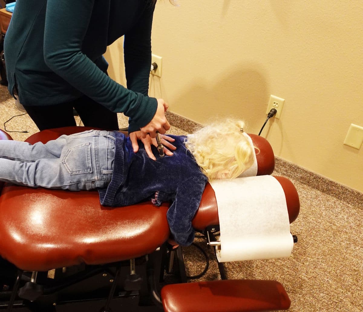 Pediatric chiropractic adjustment for children at CornerStone Chiropractic in Minot, ND